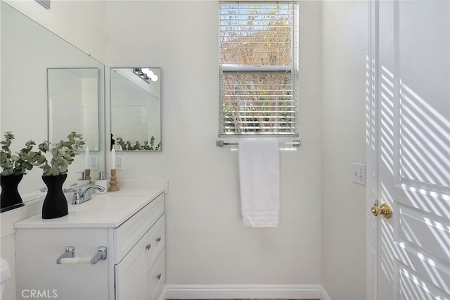 bathroom with vanity and plenty of natural light