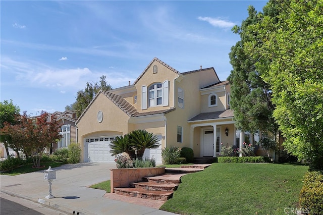 view of front facade with a garage and a front yard