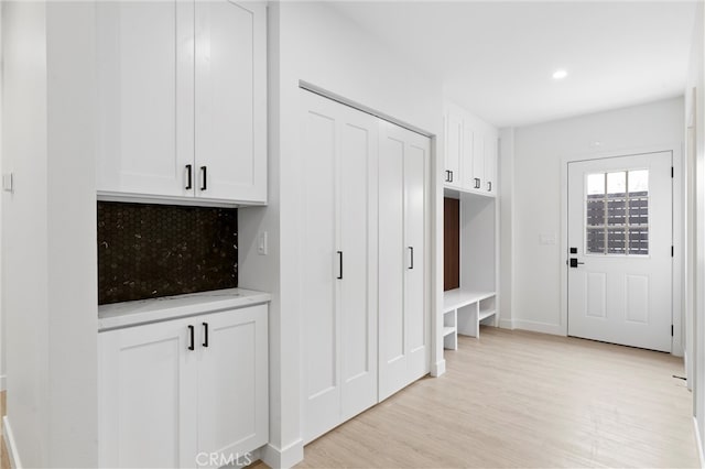 mudroom with light wood-type flooring