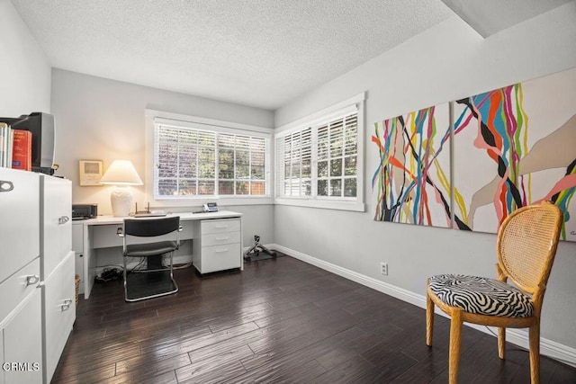 office area with dark hardwood / wood-style flooring and a textured ceiling