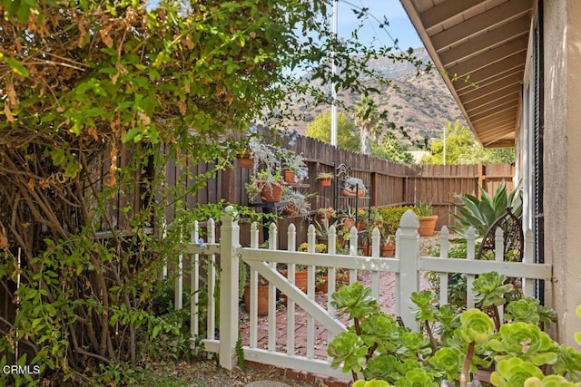 view of gate with a mountain view