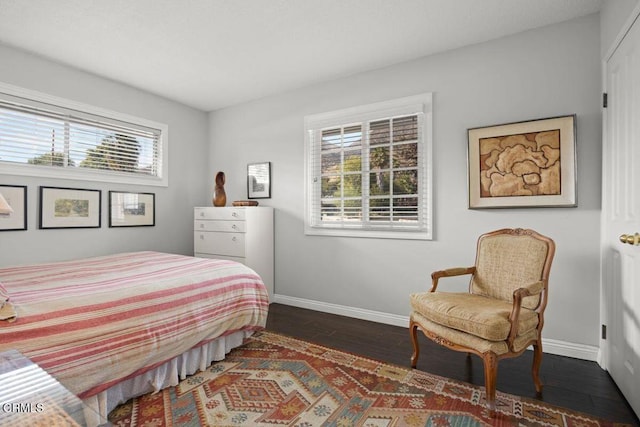 bedroom featuring dark wood-type flooring