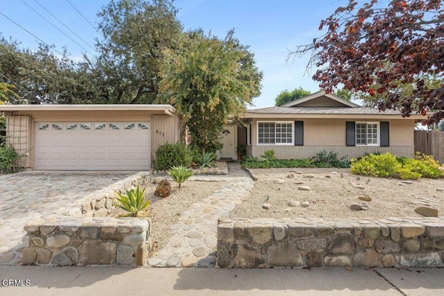 617 Pleasant Ave, Ojai, CA 93023 - ranch-style house with an attached garage, fence, and decorative driveway