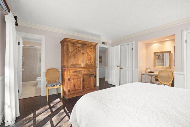 617 Pleasant Ave, Ojai, CA 93023 - bedroom featuring a closet, dark wood-style flooring, ornamental molding, and connected bathroom