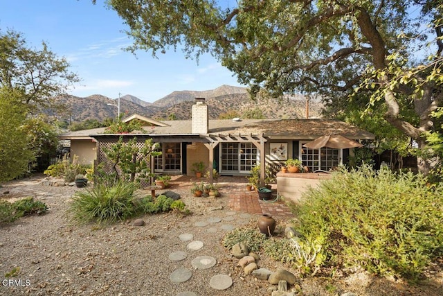 617 Pleasant Ave, Ojai, CA 93023 - back of house featuring a patio area, a mountain view, and a chimney