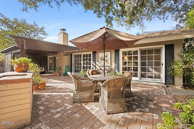 617 Pleasant Ave, Ojai, CA 93023 - rear view of house with outdoor dining space, a patio, and a chimney