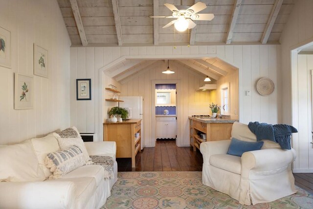 living room with vaulted ceiling with beams, wood walls, wood ceiling, and dark hardwood / wood-style floors