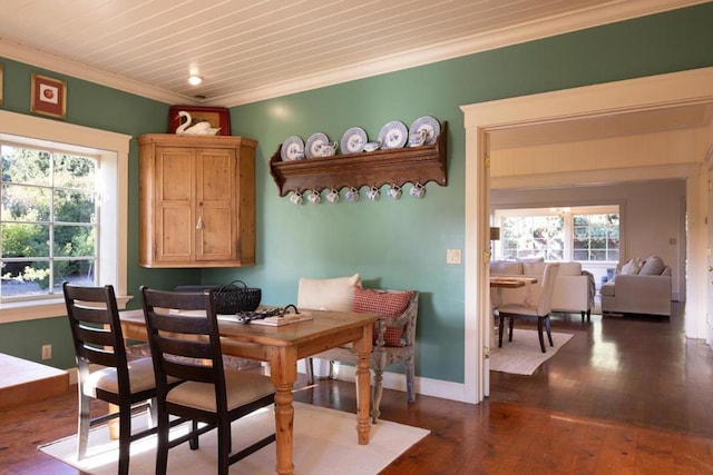 dining area featuring hardwood / wood-style flooring and ornamental molding