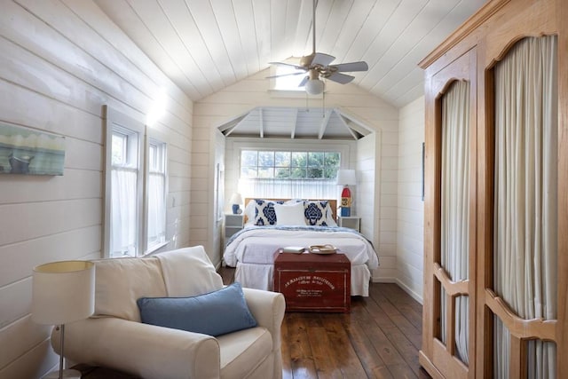 bedroom with multiple windows, ceiling fan, dark hardwood / wood-style floors, and vaulted ceiling