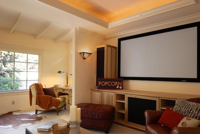 home theater room with beam ceiling and ornamental molding