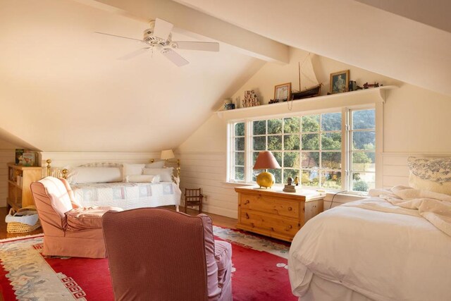 bedroom featuring hardwood / wood-style floors, ceiling fan, and lofted ceiling with beams