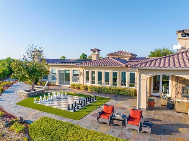 rear view of house with a patio