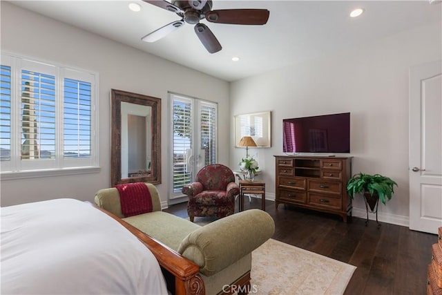 bedroom featuring ceiling fan and dark hardwood / wood-style floors