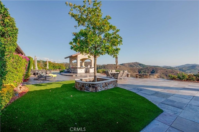 26088 Calle Catrina, Temecula, CA 92590 - view of green lawn with a patio and a mountain view
