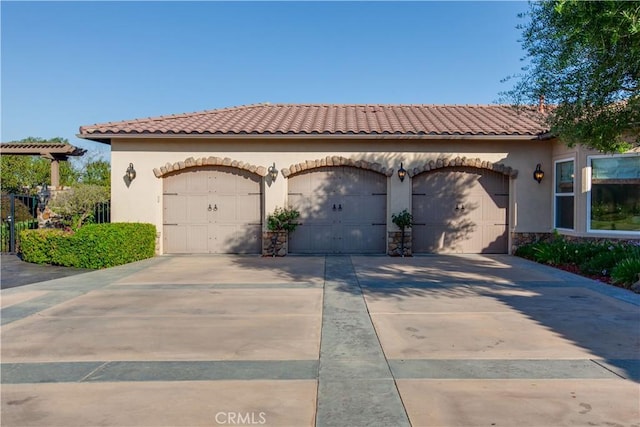 26088 Calle Catrina, Temecula, CA 92590 - mediterranean / spanish home featuring stone siding, stucco siding, concrete driveway, and a tile roof