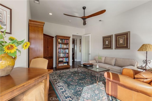 living room with ceiling fan and hardwood / wood-style flooring