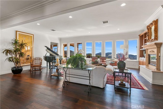 living room with dark hardwood / wood-style floors and crown molding