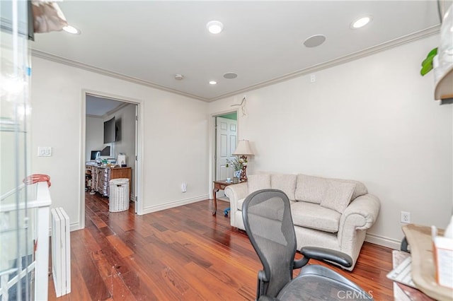 living room with dark hardwood / wood-style flooring and ornamental molding