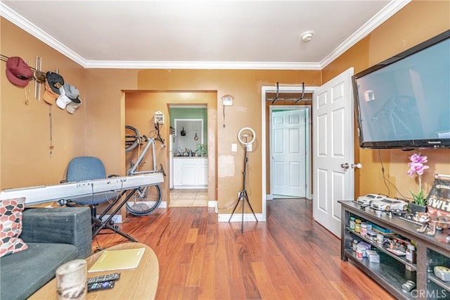 interior space featuring ornamental molding and hardwood / wood-style flooring