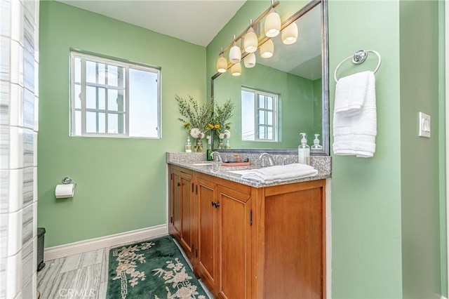 bathroom with vanity and a wealth of natural light