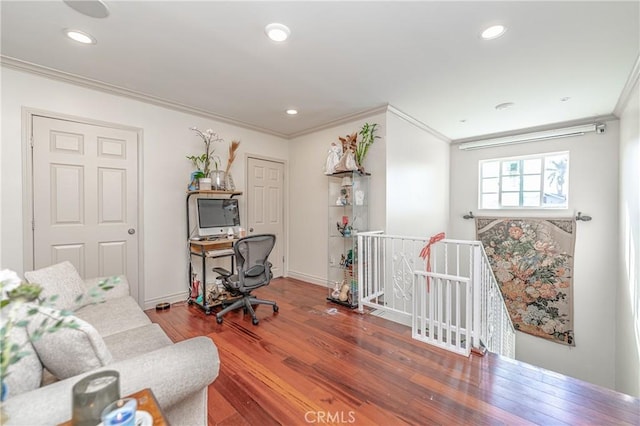 home office with hardwood / wood-style flooring and ornamental molding