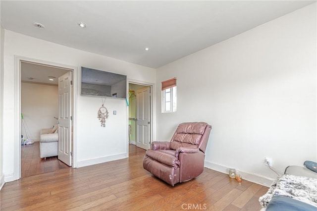 sitting room featuring hardwood / wood-style flooring