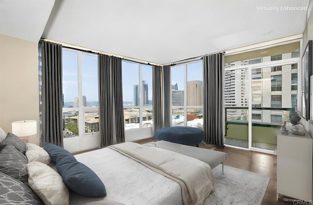 bedroom with dark hardwood / wood-style flooring