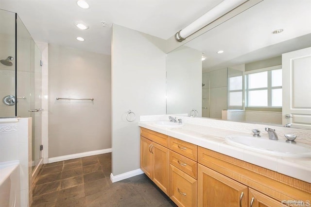 bathroom featuring vanity and a shower with door