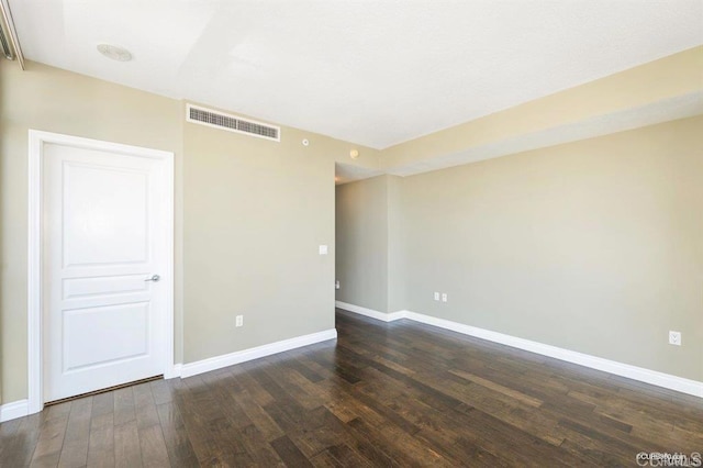 empty room featuring dark hardwood / wood-style floors