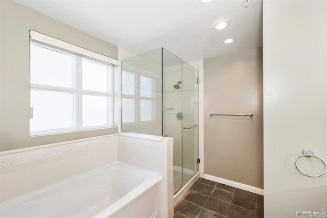 bathroom with tile patterned floors and plus walk in shower