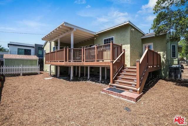 back of property with central air condition unit and a wooden deck