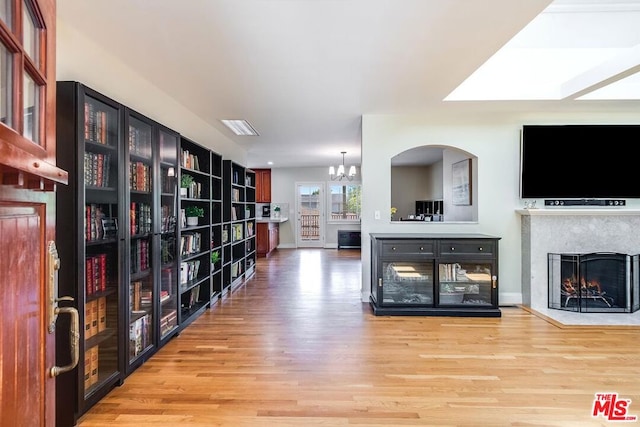 interior space with hardwood / wood-style flooring and an inviting chandelier