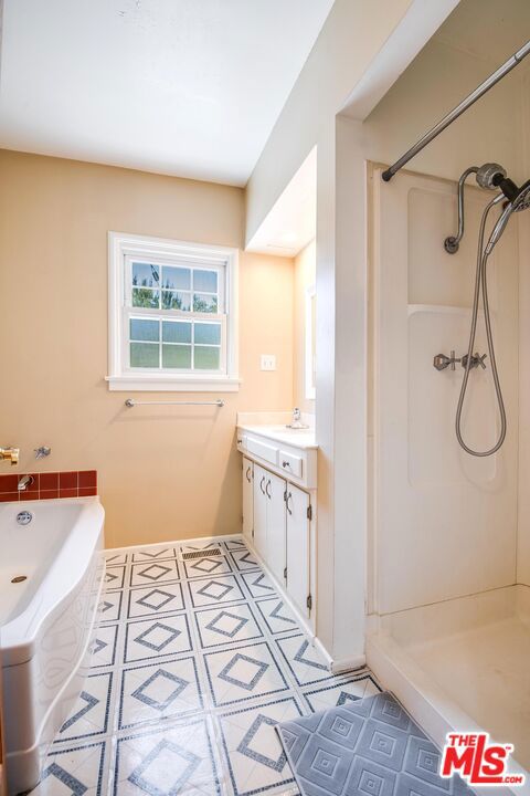 bathroom with vanity and walk in shower