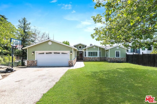 ranch-style house with a garage and a front lawn