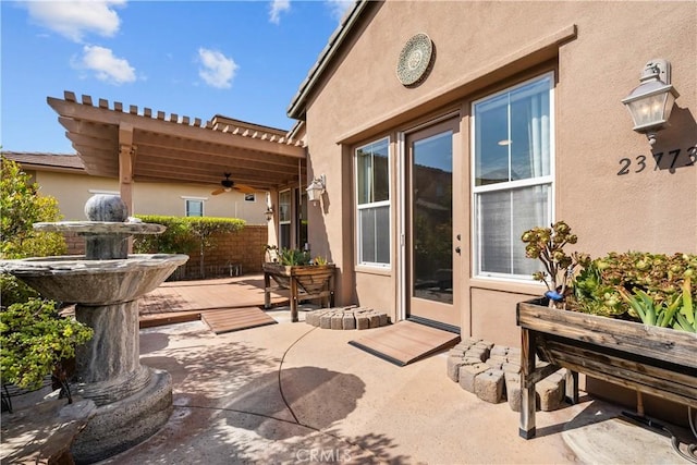 view of patio / terrace featuring a pergola and ceiling fan