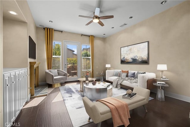 living room with ceiling fan and light wood-type flooring