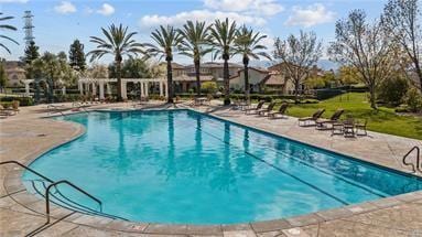 view of pool featuring a patio area