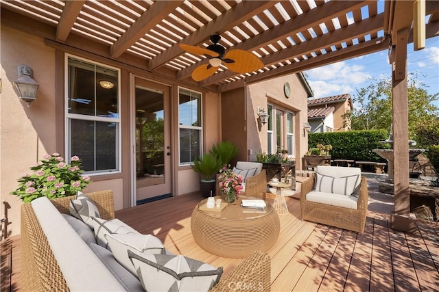 wooden deck with a pergola and an outdoor hangout area