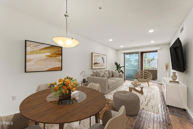 dining area with hardwood / wood-style floors