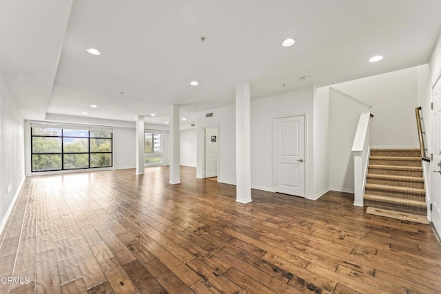 unfurnished living room featuring wood-type flooring