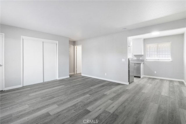 unfurnished living room with light wood-type flooring