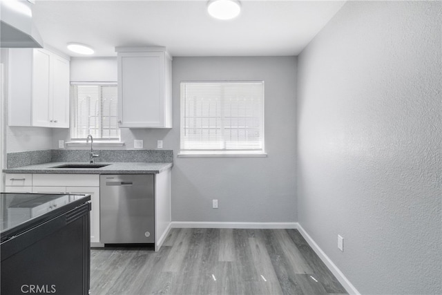 kitchen with stainless steel dishwasher, sink, white cabinets, and dark wood-type flooring