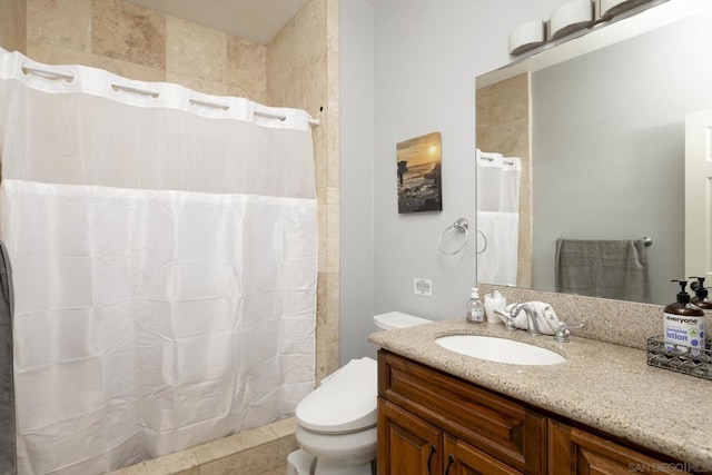 bathroom featuring curtained shower, toilet, vanity, and tile patterned flooring