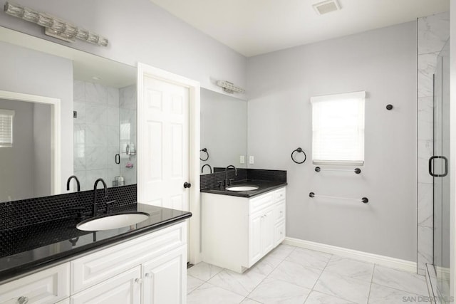 bathroom featuring an enclosed shower and vanity