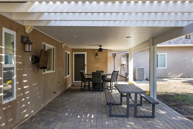 view of patio featuring ceiling fan and central AC