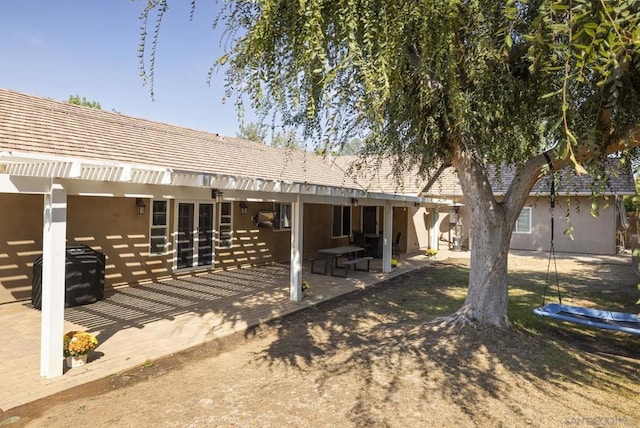 rear view of property with a patio