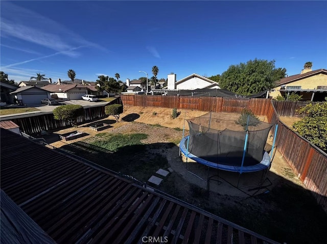 view of yard with a trampoline