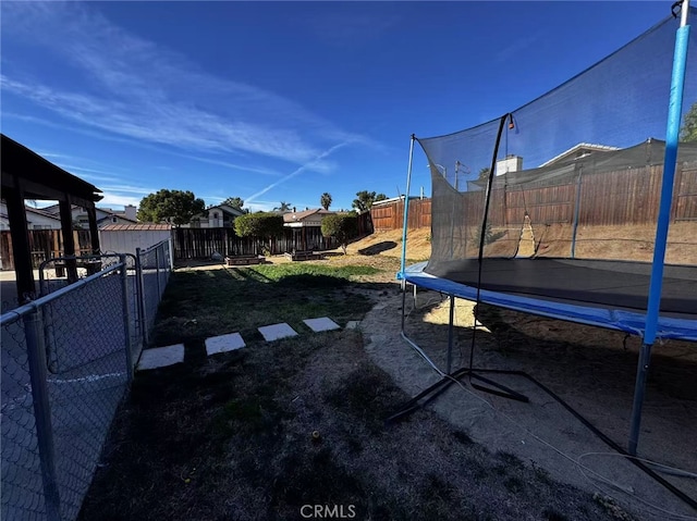 view of yard featuring a trampoline