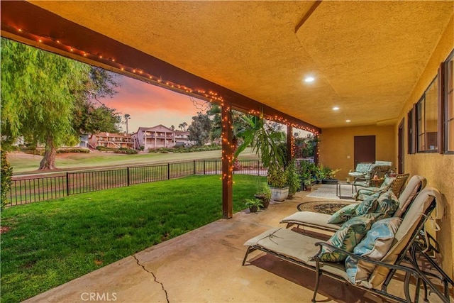 patio terrace at dusk with a yard