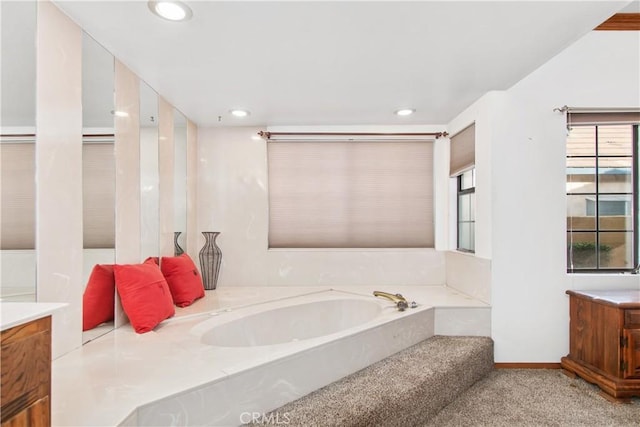 bathroom with a bathtub and vanity